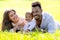 Multiethnic parents and mixed race baby in park. Multiracial family outdoor portrait. Biracial baby child on yard