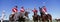 Multiethnic polo team celebrating with trophy on field