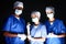 multiethnic surgeons in medical masks and gloves,