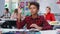 Multiethnic teen students raise hands to answer teacher question