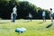 multiethnic teenage classmates playing with soccer ball in park