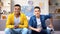 Multiethnic teenager friends emotionally watching football match at home, hobby