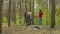 Multiethnic volunteers cleaning litter in forest