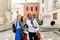 Multiethnical happy young people, African guy and two Caucasian girls, making selfie photo with funny laughing faces