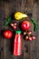 Multifruit drink in plastic bottle on wooden background top view mock up