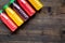 Multifruit drink in plastic bottle on wooden background top view mockup