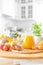 Multifruit juice and fresh fruit on table on kitchen background