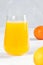 Multifruit juice in glass on white background. Orange jucie.Fresh fruits.Healthy food and drink. Limons and tangerines