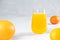 Multifruit juice in glass on white background. Orange jucie.Fresh fruits.Healthy food and drink. Limons and tangerines