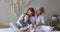 Multigenerational family play together, tickling each other resting in bedroom