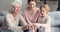 Multigenerational female family playing jenga board game together