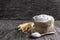 Multigrain flour in small burlap bag on rustic wooden table