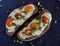 Multigrain toast bread with melt gouda or kaseri cheese and small tomatoes and green onion on top