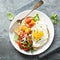 Multigrain toast with fried egg and roasted tomatoes