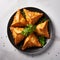 Multilayered Golden Samosas On Black Plate With Dream-like Quality