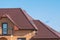 Multilevel roof under balcony with attic skylights