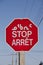 Multilingual road traffic stop sign in Inuktitut Syllabic, English and French