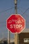 Multilingual road traffic stop sign in Inuktitut Syllabic, English and French