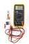 Multimeter for a measurement of a voltage, current and resistance with cables. Electrical multimeter to check the resistance on a