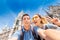 multinational couple in love hugs and takes a selfie photo on the background of The city hall tower in Munich. Honeymoon