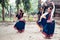 Multinational group of beautiful young classical odissi dancers wears traditional costume and posing Odissi dance mudra in the