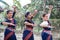 Multinational group of beautiful young classical odissi dancers wears traditional costume and posing Odissi dance mudra in the