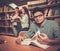 Multinational group of cheerful students studying in the university library.