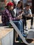 Multinational teenagers play in smartphones in schoolyard