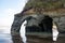 Multiple arch like rock formation at Tongaporutu Three Sisters rocks, New Zealand