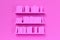 Multiple book shelves with pink books on pink wall in room, women`s literature, book collection or bookshop concept