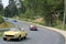 Multiple classic italian sports cars on road