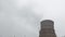 Multiple coal fossil fuel power plant smokestacks emit carbon dioxide pollution