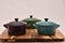 Multiple coloured cooking pots