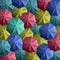 Multiple colourful umbrellas forming a beautiful texture pattern background