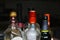 Multiple different strong spirits alcohol bottles on black background