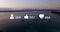 Multiple digital icons with increasing numbers against aerial view of the sea