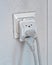 Multiple electrical plugs in wall outlet