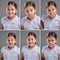 Multiple faces of a little girl on gray background