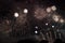 Multiple Fireworks in night sky in a composition in shades gold