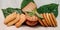 Multiple flavor biscuits isolated with green leaf in white background