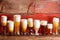 Multiple frothy beer pints on rustic wooden bench