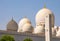 Multiple gold-tipped domes of Sheikh Zayed Mosque