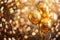 Multiple golden balloons with glitter on a bokeh background