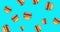 Multiple image of falling american hamburger sandwiches against blue abstract background