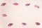 Multiple kiss mouths lipstick marks on white background