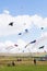 Multiple kites being flown in the sky