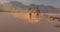 Multiple light spots floating against african american couple holding hands walking at the beach