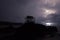 Multiple Lightning Strikes over Ocean with Island