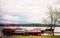 Multiple motor boats docked at a pier