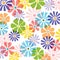 Multiple multi coloured overlapping flowers on white background